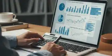 Student calculating loan interest rates on a laptop